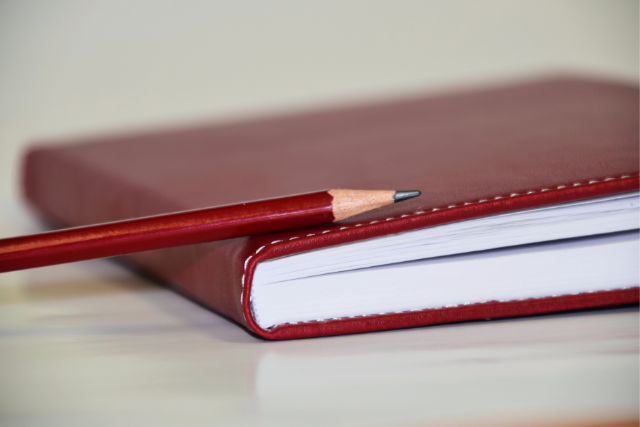 A Red Book and a pencil